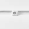 Close-up of a white textured surface with a metal screw and a white plastic cap. Anteprima dell’immagine prodotto
