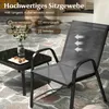 Outdoor patio setting with a chair and small table. Anteprima dell’immagine prodotto