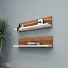Two wall shelves mounted on a gray wall, decorated with small items. Produktbild-Vorschau