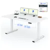 A white standing desk with dual monitors, a laptop, keyboard, mouse, and a game controller. Náhled obrázku produktu