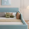 A close-up view of a bed with multiple decorative pillows. Voir les images du produit