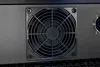 Close-up of a black fan grill on a black appliance. Anteprima dell’immagine prodotto