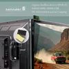 A digital satellite receiver is shown attached to the back of a TV, with a promotional image of a car driving on a dusty road displayed on the TV screen. Produktbild-Vorschau