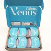 An open box containing multiple razor blade refills. Voir les images du produit