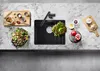 A black kitchen sink with various food items arranged around it on a marble countertop. Produktbild-Vorschau