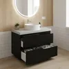 A modern bathroom vanity with a black matte finish, two drawers, and a white countertop with a vessel sink. The vanity is shown in a well-lit bathroom with wood-paneled walls and white subway tiles. Produktbild-Vorschau