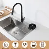 A kitchen sink with a black faucet and a cup rinser attachment, with icons representing different types of containers at the bottom. Podgląd zdjęcia produktu