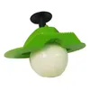 A green kitchen gadget is holding a white onion. Voir les images du produit
