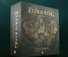 A product shot of the Elden Ring: Weeping Peninsula board game expansion box, shown at an angle against a dark teal background. Podgląd zdjęcia produktu