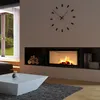 A modern living room with a fireplace and a large clock on the wall. Podgląd zdjęcia produktu