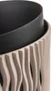 A close-up view of the textured exterior of a planter, with a dark inner liner visible. Náhľad obrázku produktu