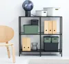 A shelf unit with various storage boxes and decorative items. Produktbild-Vorschau