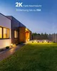 A modern house exterior at dusk with a well-maintained lawn and pathway lights. Produktbild-Vorschau