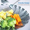A close-up shot of a steaming basket filled with vegetables, with a fork poised to retrieve food. Produktbild-Vorschau