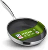 A close-up, angled view of a frying pan with a honeycomb pattern on its surface. Produktbild-Vorschau