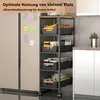 A narrow, multi-tiered rolling cart filled with various kitchen items like fruits, jars, and paper rolls, placed next to a refrigerator and kitchen cabinets. Voir les images du produit
