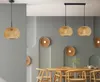 A dining room with a table and chairs, illuminated by pendant lights. Produktbild-Vorschau