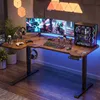 A gaming desk setup with multiple monitors, a computer tower, and accessories, illuminated by LED lighting. Náhled obrázku produktu