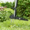 A close-up view of a garden tool, specifically a weed remover, in action on a grassy lawn. Produktbild-Vorschau