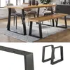 A dining table and bench set with black metal legs and wooden tops, set on a rug in a dining room. Náhled obrázku produktu