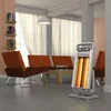 A living room scene with chairs, a coffee table, and a heater. Náhled obrázku produktu