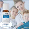 A family (mother and two children) smiling, with a product bottle in the foreground. Náhľad obrázku produktu