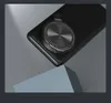 A black phone case with a magnetic ring holder is shown on a geometric stand. Produktbild-Vorschau