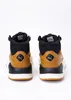 A pair of Puma X-Ray Speed Mid WTR Winter boots shown from the back. Voir les images du produit