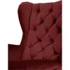 Close-up of a tufted wingback chair. Náhled obrázku produktu
