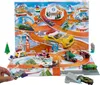 A Hot Wheels advent calendar with toy cars and a winter-themed track. Produktbild-Vorschau