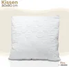 A white quilted pillow is presented against a light beige and white background, with text indicating product details. Produktbild-Vorschau