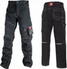Two views of black work pants with orange stitching, displayed against a white background. Náhled obrázku produktu