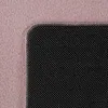 A close-up view of a pink rug with a black textured area. Produktbild-Vorschau