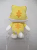 A plush toy cat is displayed on a clear acrylic stand against a white background. Podgląd zdjęcia produktu