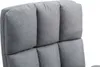 A close-up view of the quilted fabric headrest of a gray office chair. Náhled obrázku produktu