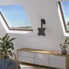 A TV ceiling mount is installed on a sloped ceiling in a room with skylights and a wooden cabinet. Náhled obrázku produktu