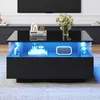 A modern black coffee table with LED lighting and decorative items on top. Produktbild-Vorschau