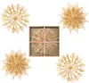 A collage of four straw star ornaments, one of which is in a box with pink ribbon. Produktbild-Vorschau