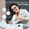 A woman is holding a portable bottle warmer with a baby bottle in it, next to a stroller. Náhľad obrázku produktu