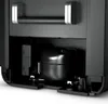 A close-up view of the internal components of a Dometic CFX3 45 cooler, showing the compressor and other mechanical parts. Produktbild-Vorschau