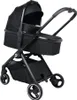 A black baby stroller with a bassinet attachment, shown from a three-quarter side view against a white background. Produktbild-Vorschau