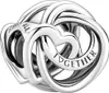 A close-up studio shot of a silver charm shaped like interlinked hearts. Podgląd zdjęcia produktu
