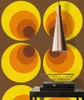 A wall with retro-style circular wallpaper pattern and a copper pendant light fixture. Produktbild-Vorschau