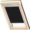 A VELUX Original Verdunkelungsrollo Classic for VELUX roof windows, in black, is shown installed in a wooden framed roof window. Produktbild-Vorschau