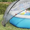 A transparent pool dome covers an inflatable pool in a backyard setting. Náhled obrázku produktu