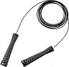 A black Nike speed rope coiled on a white background. Podgląd zdjęcia produktu