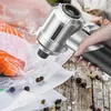 A hand holding a portable vacuum cleaner, using it to seal a plastic bag containing salmon. Produktbild-Vorschau