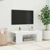 A white TV stand with a television mounted on the wall above it, in a room with a large potted plant and a basket. Náhľad obrázku produktu