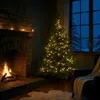 A cozy living room scene with a fireplace and a decorated Christmas tree. Produktbild-Vorschau