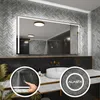 A modern bathroom with a large LED-lit mirror above a marble countertop with a sink and faucet. Produktbild-Vorschau